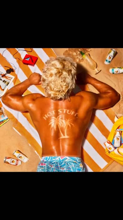 HOT STUFF! The dreamy @caracormack_ had a vision for this incredible shoot supported by @malibu_rum.
To create this look I made several stencils out of acetate that I cut out with a craft knife. I didn’t know exactly how big our bodybuilder @elliott_minnet’s back was going to be and it needed to be the right size. I then airbrushed tan makeup and also my favourite Sunburn spray in Pinky by Maekup over the stencil, let it dry and then voila! Then we followed that with a spritz of baby oil mixed in with water. I also put a cheeky tan line near his bathers. I sourced the wig from @am_thewigstore. Thank you so much to Kelly for your help. The wig was steamed with some rollers in to create some movement. Creative Direction/ Photography @caracormack_
Drinks Stylist - @aliceostan
MUA - @chamiltonpro
Hair / SFX - @victoriapolandmakeup
Hair / SFX Assistant - @loisharperbeauty
Wardrobe Stylist - @mairjoint_stylist Wardrobe Assistant - @Elsie_vincent Movement Director - @theweirdbird
Set and Props - @ma_gent
Props Stylist - @mrluisperal
Casting Agent - @cbacasting
Talent - elliott_minnett
Producer and beyond - @jamesbrewerphoto
BTS shot and edited by @mishapanxv
Assistant - @hudsonjrippon
Digi Op -@sarah.wilso.n
Gaffer - @connortegan
Agent - @headofphotochris @kodemedia
Retouch - @retouchedbyadam