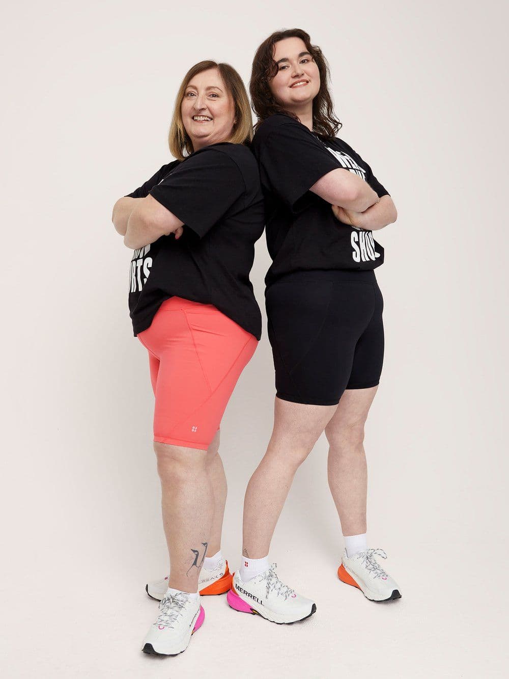 picture of mother and daughter looking proud in their sweaty betty shorts
